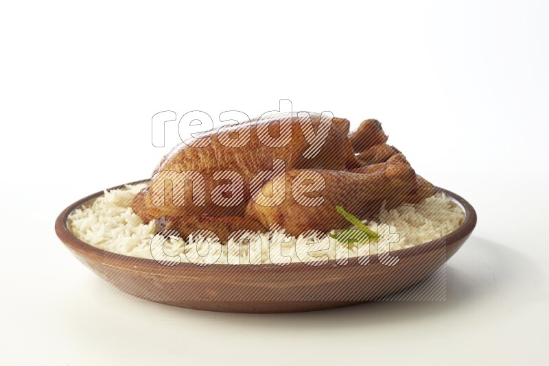 white  basmati Rice with  whole roasted chicken    on a pottery plate  direct  on white background