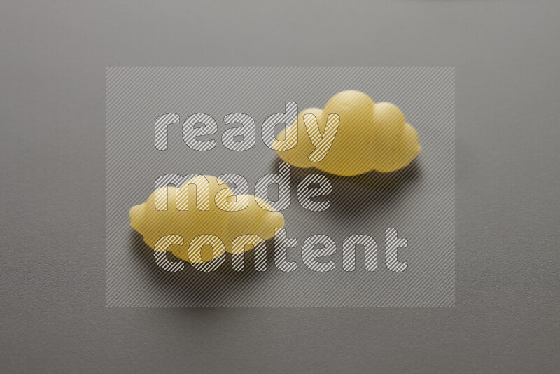 Snails pasta on grey background