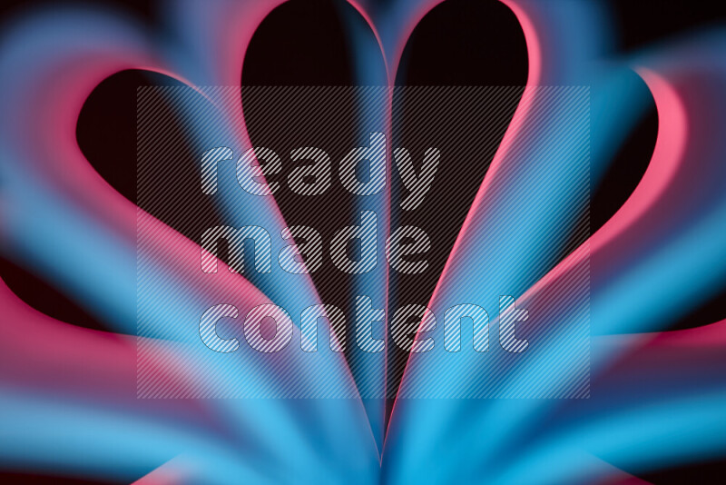 فن تجريدي يعرض منحنيات وتدرجات اللون الأزرق والأحمر مكونه بضوء ملون