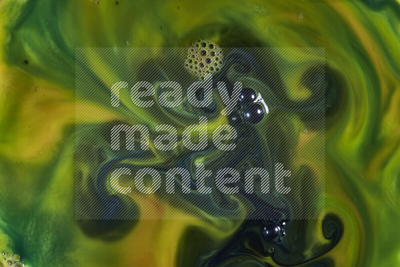 A close-up of abstract swirling patterns in orange and green