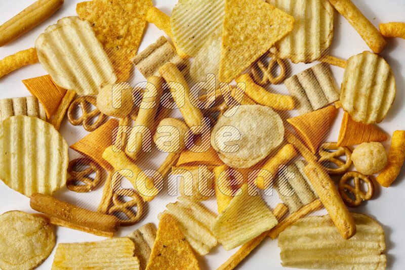 Assorted snacks on white background