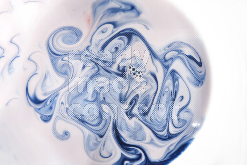 A close-up of abstract swirling patterns in blue, red and white