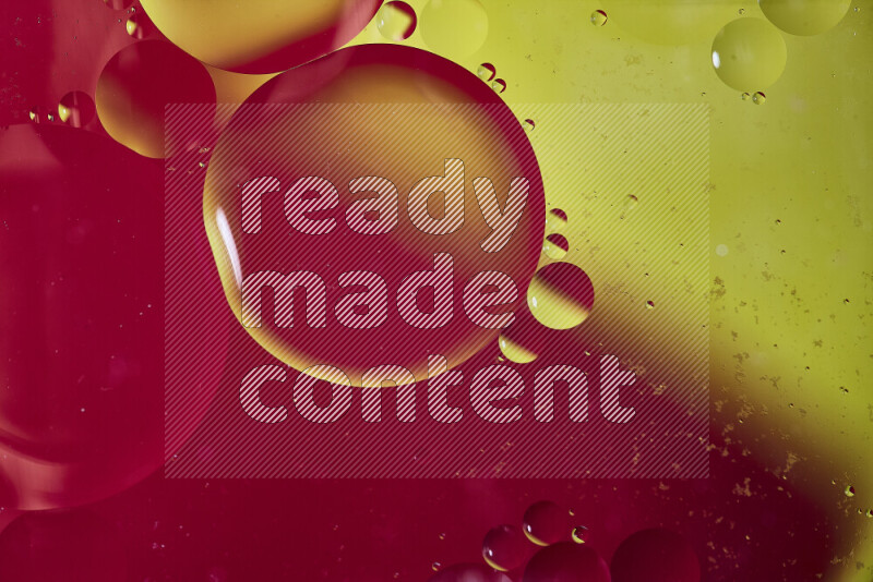 Close-ups of abstract oil bubbles on water surface in shades of red and yellow