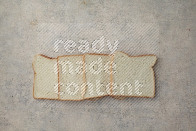 White Toast slices on alight blue textured background