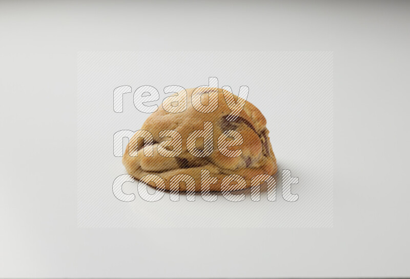 a chocolate chip cookie on a white background