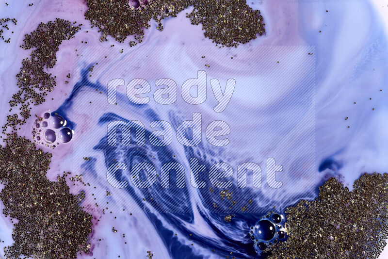 لقطة مقربة لبريق ذهبي متلألئ منتشر على خلفية من اللون الأزرق والأحمر في حركات دائرية