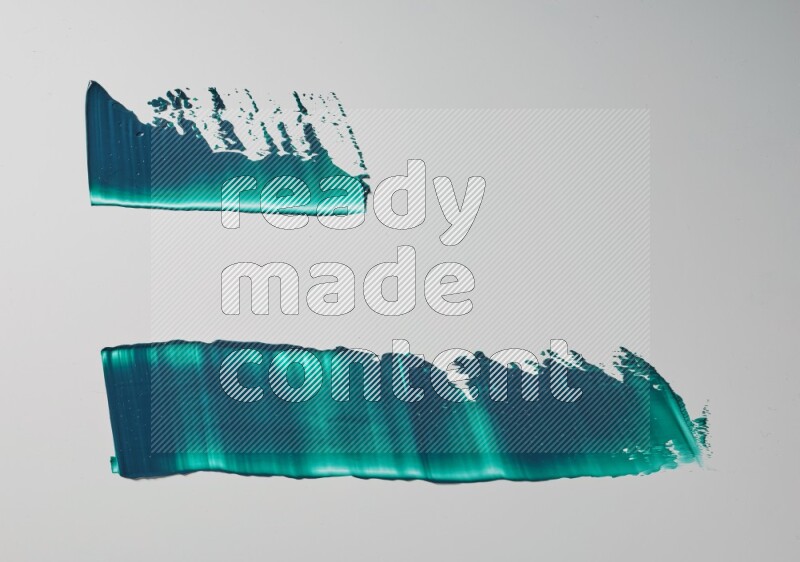 Turquoise painting knife strokes on white background
