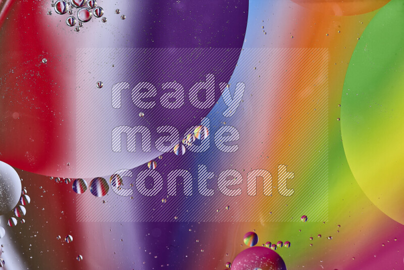 Close-ups of abstract oil bubbles on water surface in multicolors