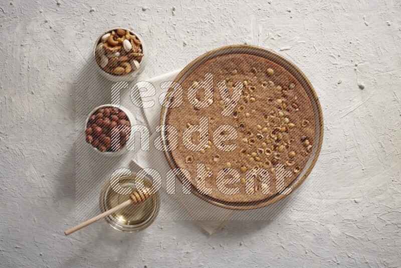 Basbousa with nuts and honey in a light setup