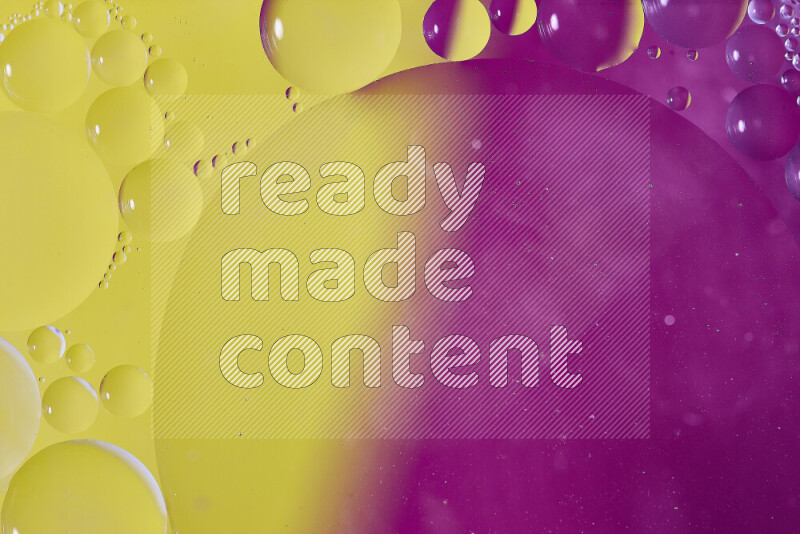 Close-ups of abstract oil bubbles on water surface in shades of yellow and pink