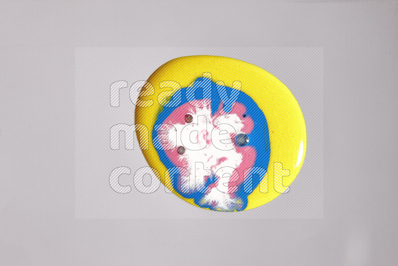 Close-ups of assorted colors blending on a grey background