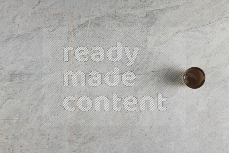 A multicolored pottery Cup on grey marble background