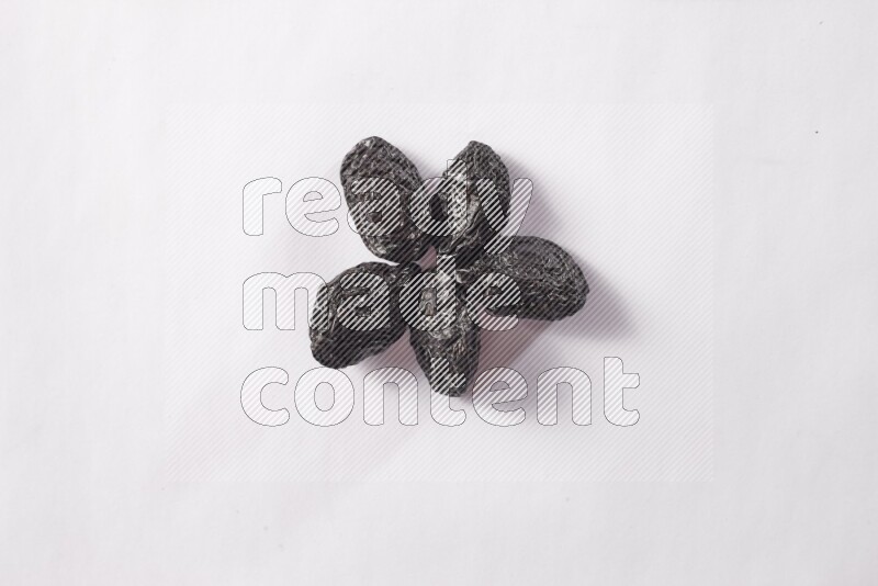 Dried plums on white background