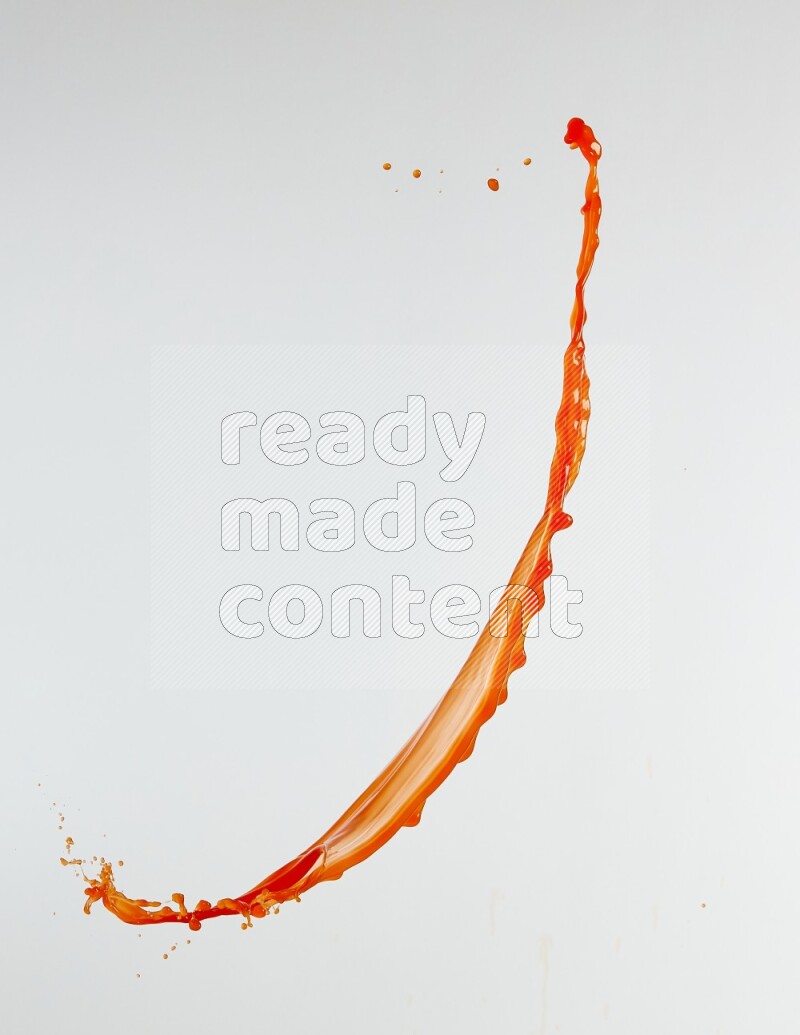 Orange liquid splash and drops on white background