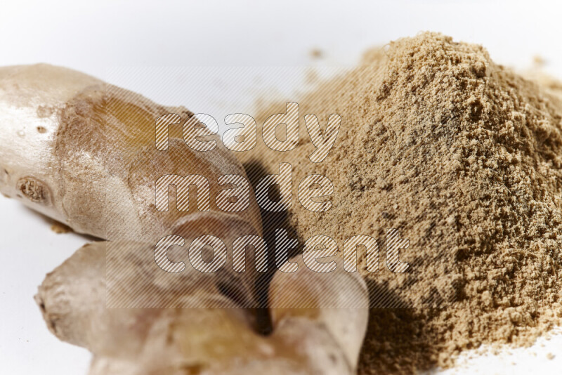 A bunch of ground ginger powder on white background