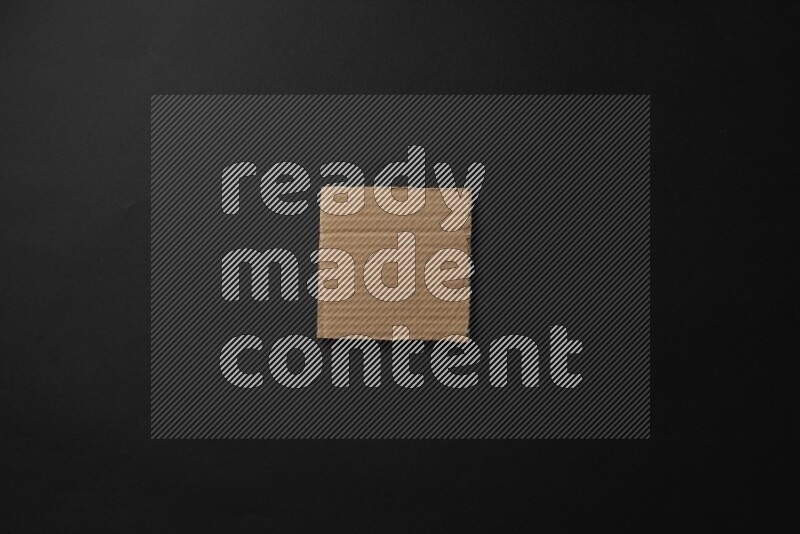 Cardboard in shapes on black background