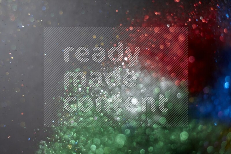 Multicolored glitter powder isolated on black background