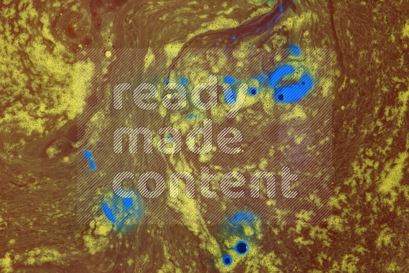 The image depicts a marbling effect with swirling patterns of red, blue and yellow