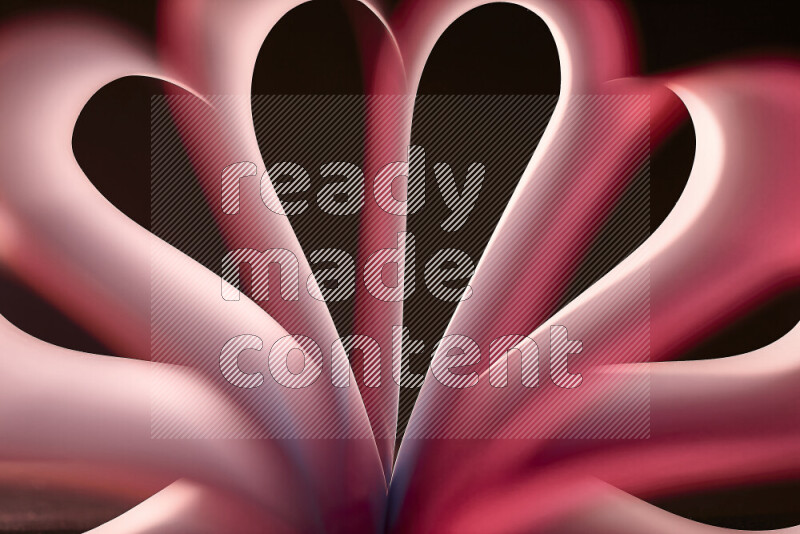 An abstract art piece displaying smooth curves in white and pink gradients created by colored light