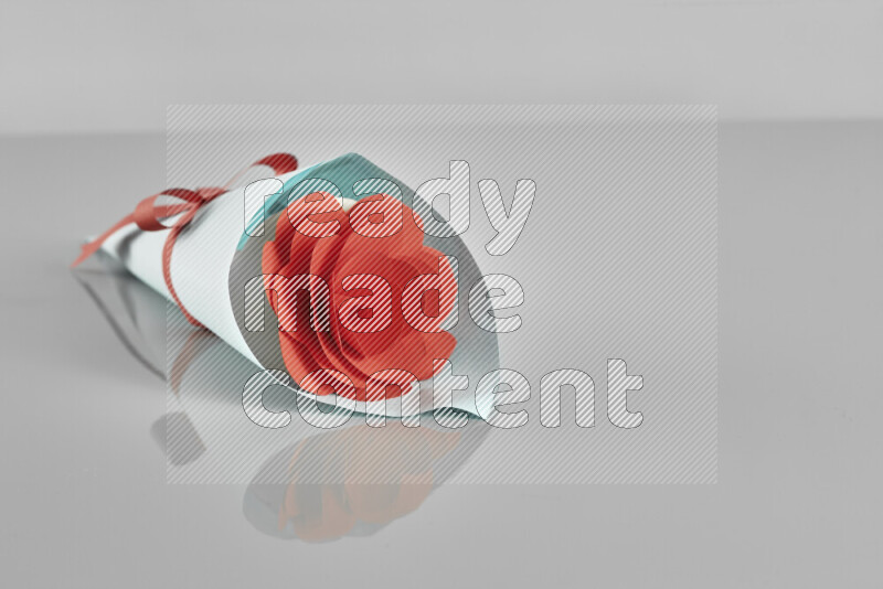 Origami flower bouquet on grey background