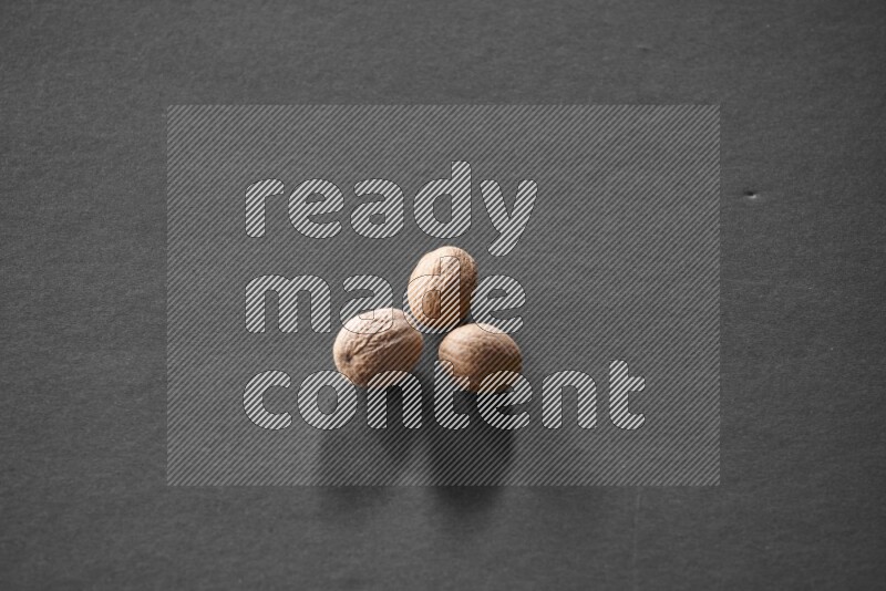 Nutmeg on a black flooring