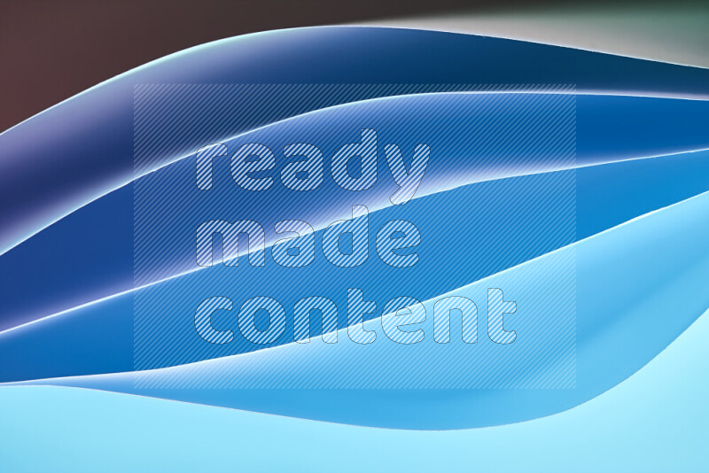 This image showcases an abstract paper art composition with paper curves in blue gradients created by colored light