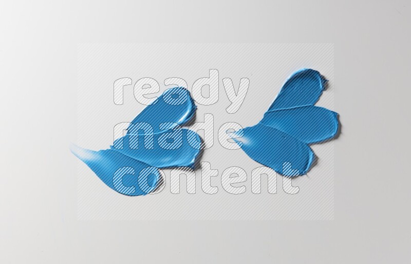 Blue painting knife strokes on white background