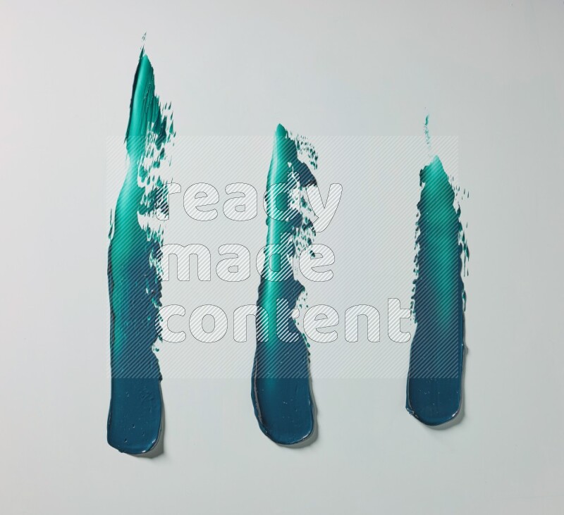 Turquoise painting knife strokes on white background