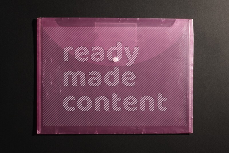 Pink plastic file on black background