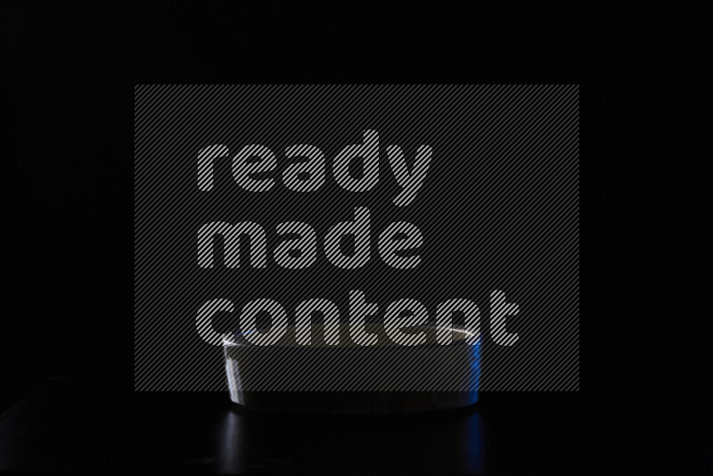 Potteries with colored rim light against black background