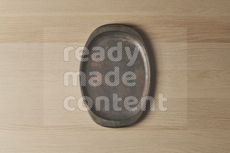 A vintage metal tray on light wooden background