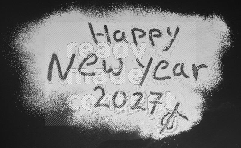 A sentence written with powder on black background