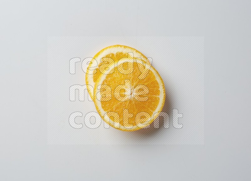 Two orange slices on white background