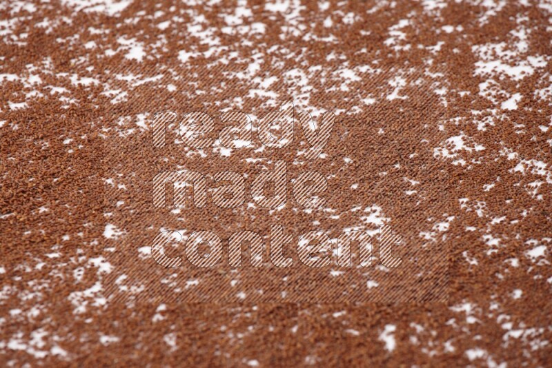 Garden cress seeds spread on a white flooring
