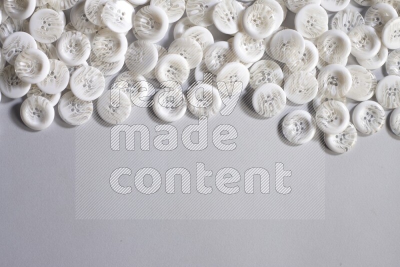 White buttons placed on grey background