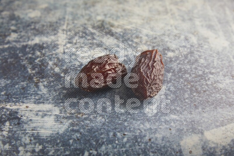 two madjoul dates on a rustic blue backround