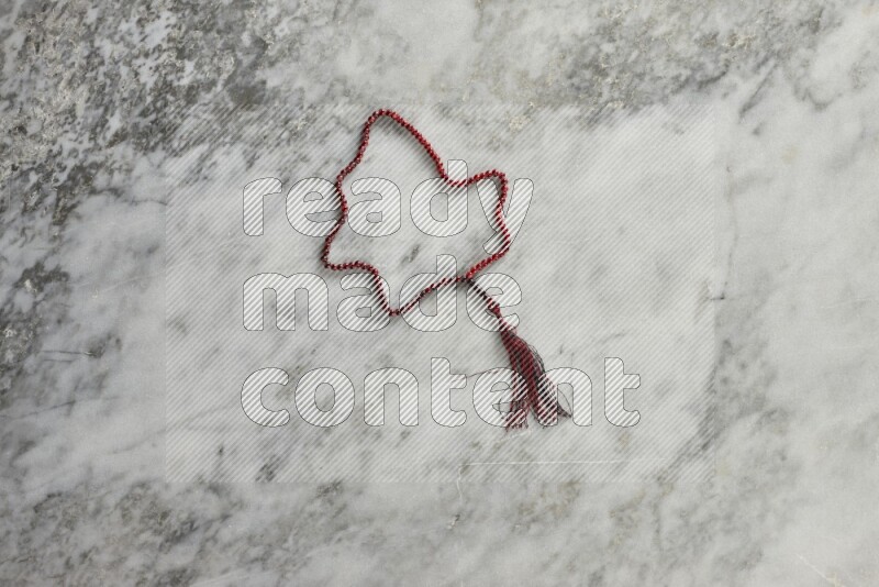 A prayer beads placed on grey marble background