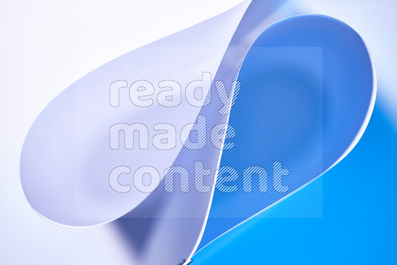 An abstract art of paper folded into smooth curves in white and blue gradients