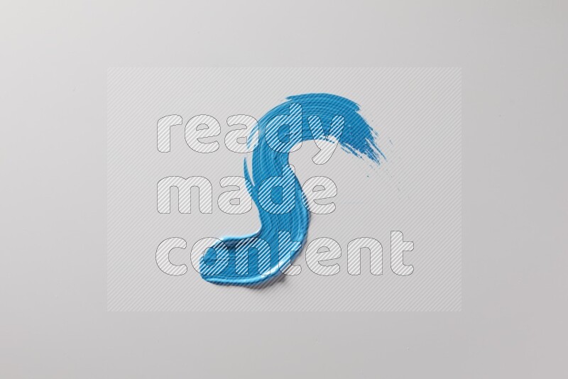 A single blue S curved brush stroke on a white background