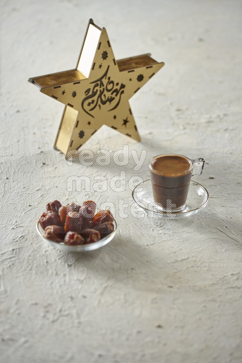 A wooden golden star lantern with different drinks, dates, nuts, prayer beads and quran on textured white background
