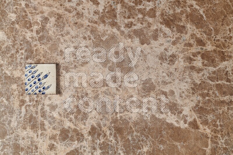 A decorative coaster on beige marble background