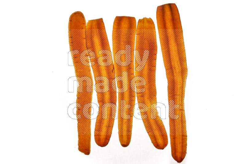 Carrots slices on illuminated white background