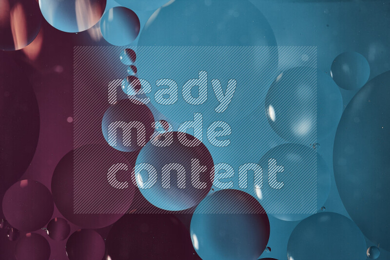 Close-ups of abstract oil bubbles on water surface in shades of blue and purple