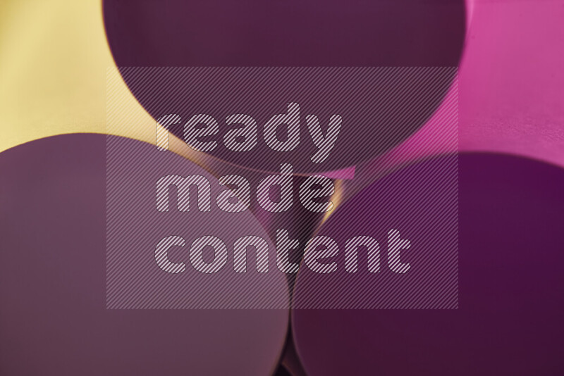 The image shows an abstract paper art with circular shapes in varying shades of pink and warm tones