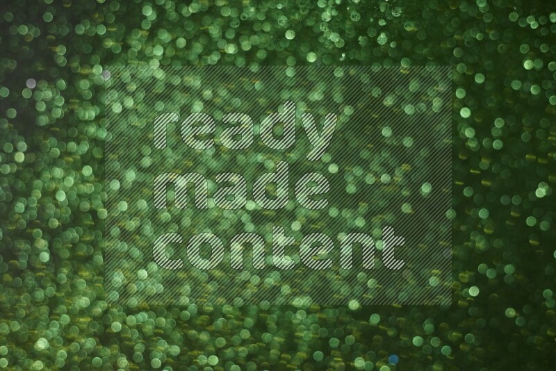 Green glitter powder isolated on black background