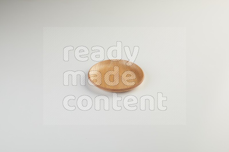 Wooden bowl and plate on white background