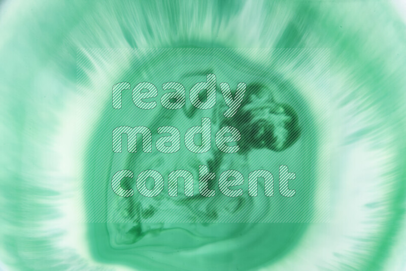 لقطة مقربة لأنماط دوامية بتدرجات اللون الأخضر