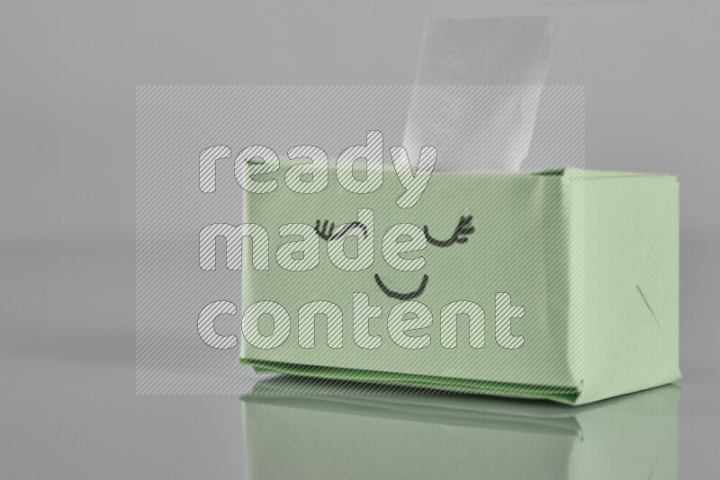 Origami tissue box on grey background