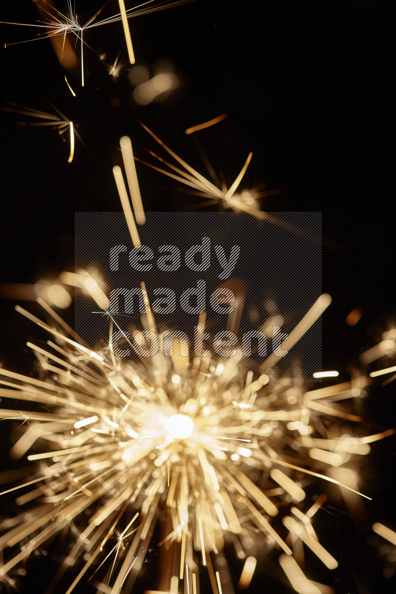 A close-up image of sparkler candle isolated on black background