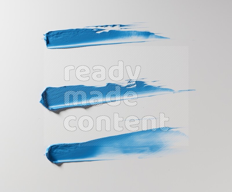 Blue painting knife strokes on white background